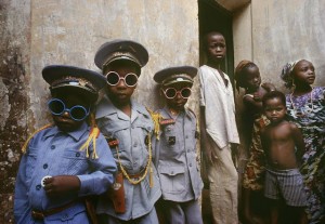 Three children in Kano dressed in uniforms bought by their father during his last pilgrimage to Mecca. Kano. 1982